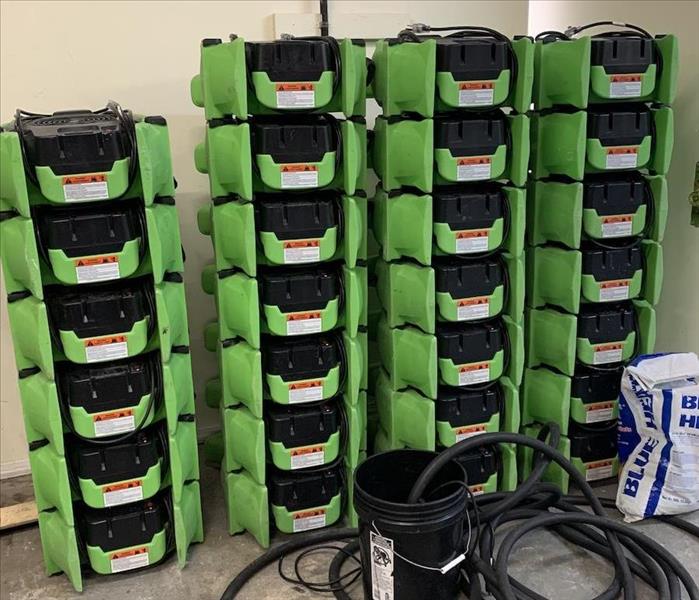 Stacked SERVPRO equipment in home